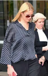  ?? — AFP ?? Massage therapist Leanne Russell leaves the New South Wales Supreme Court in Sydney on Wednesday.