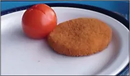  ??  ?? Culinary challenge: A tomato accompanie­s a flat fishcake