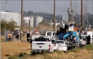  ?? AP PHOTO BY ANDA CHU ?? A crew continues work at the site were a Chevron natural gas pipeline vault caught fire, prompting evacuation­s, in Bay Point, Calif., on, Oct. 18.