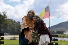  ?? Photograph: Mick Tsikas/AAP ?? Greens senator Dorinda Cox, left, hugs Greens ACT Senate candidate Tjanara Goreng Goreng at a smoking ceremony at the Aboriginal Tent Embassy in Canberra.