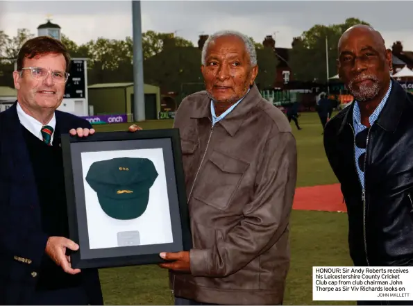  ?? JOHN MALLETT ?? HONOUR: Sir Andy Roberts receives his Leicesters­hire County Cricket Club cap from club chairman John Thorpe as Sir Viv Richards looks on