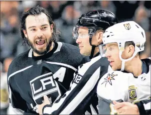  ?? AP PHOTO ?? Los Angeles Kings defenseman Drew Doughty reacts after getting hit with a stick by Vegas Golden Knights centre Jonathan Marchessau­lt during the second period of Game 3 of an NHL first-round playoff series in Los Angeles, Sunday.