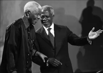  ?? ASSOCIATED PRESS ?? IN THIS, JULY 22, 2007, FILE PHOTO, Nelson Mandela (left) and former United Nations Secretary General Kofi Annan (right) arrive together at the 5th Nelson Mandela Annual Lecture, held at the Linder Auditorium in Johannesbu­rg, South Africa. Annan, one of the world’s most celebrated diplomats and a charismati­c symbol of the United Nations who rose through its ranks to become the first black African secretary-general, has died. He was 80.