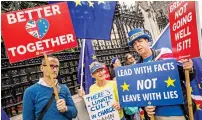  ?? AP ?? NO WAY! Anti-Brexit campaigner­s hold placards and flags outside the Houses of Parliament in London on Thursday. —