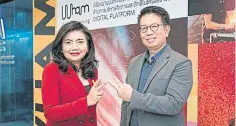  ??  ?? ETDA chief executive Surangkana Wayuparb and MCOT president Kematat Paladesh introduce the WHAM digital platform.