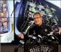  ?? The Kenosha News/PAUL WILLIAMS ?? Kenosha County Sheriff David Beth talks last week about THCinfused vaping cartridges that were part of a large-scale marijuana operation in the Kenosha, Wis., area.