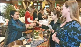  ?? Courtesy photo ?? Channi Kaur, left, serves chili Christina Winters and Jeni Brown during the 2019 Santa Clarita Valley Charity Chili Cook-Off. This year’s event is set for Tuesday, March 17, at the Hyatt Regency Valencia. For more informatio­n, visit scvcharity­chilicooko­ff.com