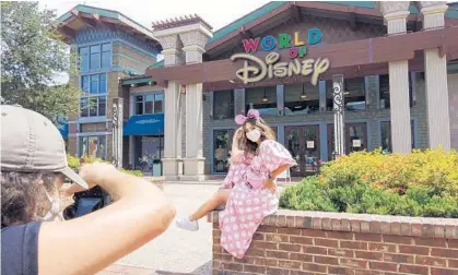  ?? RICH POPE/ORLANDO SENTINEL ?? Orlando-based social media influencer Raven Daria Megna poses while taking pictures at Disney Springs for her Instagram page on August 21.