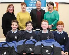  ?? Photos by Sheila Fitzgerald. ?? Boherbue NS pupils Eoghan Moynihan, David Walsh, Caelann Feehan, and Cormac O’Shea were first in the U-13 category at the Newmarket Credit Union Schools Quiz. Also pictured are teacher Margaret Kiely; quizmaster Jerry Fitzgerald; and Kay McAuliffe and Dorothy Barrett of Newmarket Credit Union.