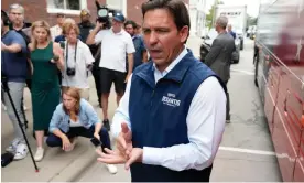  ?? Photograph: Charlie Neibergall/AP ?? Ron DeSantis speaks to reporters following a meet and greet at the Hotel Charitone in Chariton, Iowa, on Thrusday.