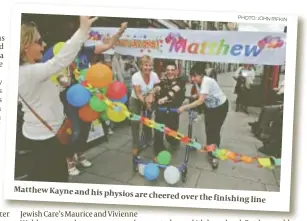  ?? PHOTO: JOHN RIFKIN ?? Matthew Kayne and his physios are cheered
over the finishing line