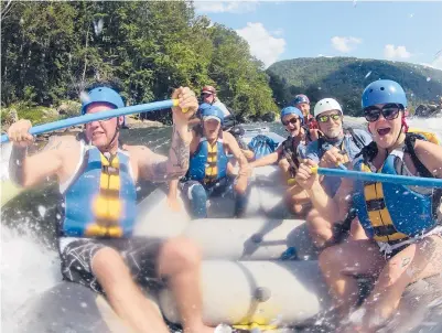  ?? CHARLESTON GAZETTE 2012 LAWRENCE PIERCE/ ?? Whitewater rafters explore the lower New River Gorge, near Fayettevil­le, W.Va. A program launched Monday will try to lure outdoor enthusiast­s to live and work in West Virginia with enticement­s of $12,000 cash and other benefits.