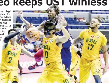  ?? (Rio Leonelle Deluvio) ?? NU’s Issa Gaye loses the ball as he drives through a phalanx of FEU defenders during their UAAP game yesterday at the Smart Araneta Coliseum. The Tamaraws won, 90-83.