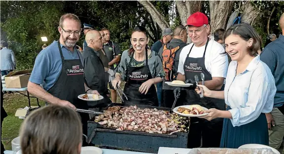  ??  ?? The Labour/Green coalition serve up breakfast after the dawn service at the Waitangi Treaty Grounds on Waitangi Day.