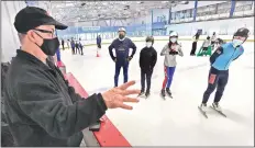  ?? Dan Watson/The Signal ?? Santa Clarita Speed Skating Club President Ron Halcrow, left, gathers the skaters together as they begin practice at The Cube in Valencia on Wednesday.