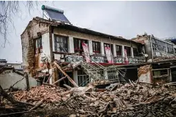  ?? ?? COLLAPSED BUILDING — A general view shows a collapsed building after an earthquake in Dahejia, Jishishan County in northwest China’s Gansu province on Dec. 19, 2023. (AFP)