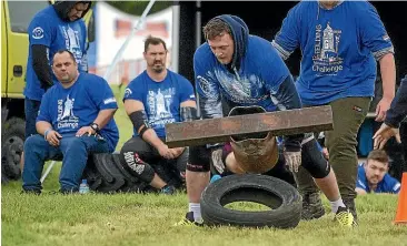  ??  ?? Tommy Locke, of Palmerston North, drops the 130-kilogram weight in the anvil carrying event when he could go no further.