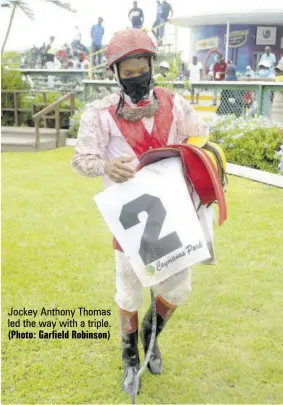  ?? (Photo: Garfield Robinson) ?? Jockey Anthony Thomas led the way with a triple.