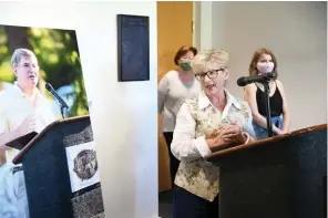  ?? The Sentinel-record/tanner Newton ?? Susan Dugan speaks Saturday during a dedication ceremony naming Room 105 at the Hot Springs Convention Center after her late husband, baseball historian Mike Dugan, with daughter Mary Kate Dugan Whitmire, right.