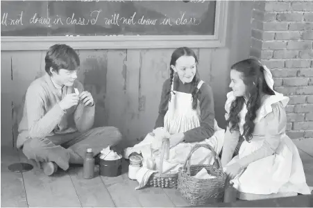  ?? CBC ?? Some new faces enter the picture in Season 2 of Anne with an E, inspired by Canadian author Lucy Maud Montgomery’s Prince Edward Islandset Anne of Green Gables. Vancouver’s Cory Gruter-Andrew, left, plays Cole, alongside Amybeth McNulty as Anne and Dalila Bela as Diana.