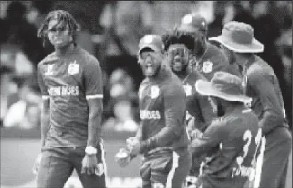  ?? ?? Fast bowler Isai Thorne (left) celebrates one of his two wickets with teammates. (Photo courtesy ICC)