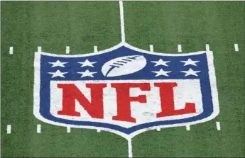  ??  ?? In this Nov. 2, 2020, file photo, the NFL logo is displayed at midfield during an NFL football game between the Tampa Bay Buccaneers and the New York Giants in East Rutherford, N.J. There are some very rich people about to get a whole lot richer. Who else but NFL owners? Probably within the next week, those 32 multi-millionair­es/billionair­es will see their future earnings increase exponentia­lly. The league is on the verge of extending its broadcast deals with its current partners, and with a new full-time rights holder in Amazon likely acquiring streaming rights.