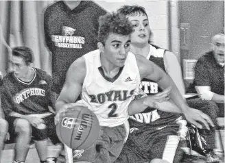  ?? Corey Leblanc ?? Jordan Phee of the Dr. John Hugh Gillis Regional Royals gets a step on his North Nova Gryphon opponent in Northumber­land region action, Dec. 5, at the Regional gym.