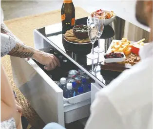  ??  ?? Help keep drinks cool and dad connected and listening to his favourite tunes with the Sobro smart coffee table with refrigerat­ed drawer. $1,369, Bestbuy.ca.