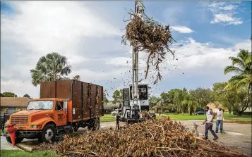  ?? ALLEN EYESTONE / THE PALM BEACH POST ?? With contracts in place before the storm, Palm Beach County’s Solid Waste Authority oversaw removal or processing of 2.3 million cubic yards of debris in the aftermath of Hurricane Irma last year.