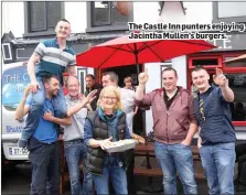  ??  ?? The Castle Inn punters enjoying Jacintha Mullen’s burgers.