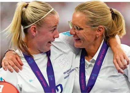  ?? AP ?? Euro stars: a beaming Beth Mead (left) and Wiegman embrace at Wembley