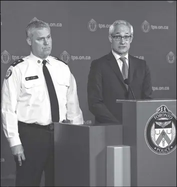  ?? CP PHOTO ?? Toronto Police Inspector Bryan Bott, left, and Chief Coroner for Ontario Dr. Dirk Huyer, speak at a news conference in yesterday on the identities of the victims of the Yonge Street van attack and the current state of the investigat­ion.
