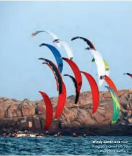  ??  ?? Windy conditions near Pingtan's coast attract many kite-surfers