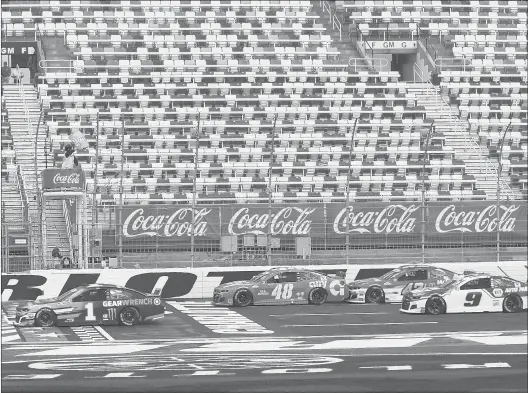  ?? GERRY BROOME/AP ?? Kurt Busch (1) leads the pack as the green flag is waved at the start of the Coca-Cola 600 NASCAR Cup Series race at Charlotte Motor Speedway on Sunday. The race was held without fans.