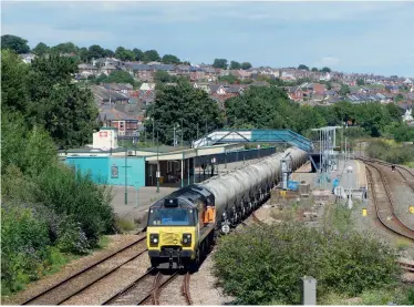  ??  ?? ABOVE: Tarmac stopped sending cement by rail from Aberthaw in 2020, leading to the loss of flows to Westbury and Moorswater. Colas Class 70 70810 passes Barry with the 6C36 1237 WestburyAb­erthaw empties on July 20, 2020.