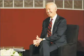  ?? Tim Tai / Associated Press ?? In this Feb. 19 file photo, former Vice President Joe Biden reacts as he talks with University of Pennsylvan­ia President Amy Gutmann at the university’s Irvine Auditorium in Philadelph­ia. Biden on Sunday defended his interactio­ns with women, saying he doesn’t believe he’s ever acted inappropri­ately.