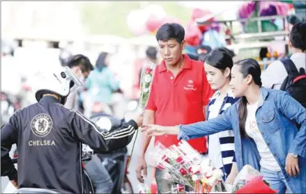  ?? HEAN RANGSEY ?? The Valentine’s Day event aims to reinforce students’ Buddhist values.