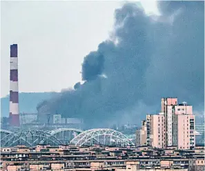  ?? ?? Fresh attack: Smoke rises from buildings in Kyiv amid 81 new air strikes