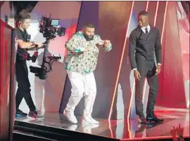  ?? Rich Polk Getty Images ?? DJ KHALED heads out to accept hip-hop song of the year for “Wild Thoughts.”