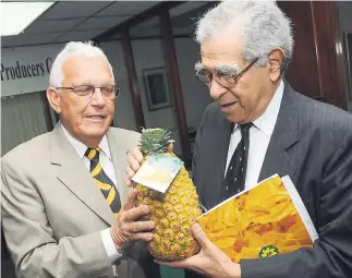  ?? CONTRIBUTE­D
PHOTOS ?? Emil George (right) and
Charles Johnston, past president of the
Shipping Associatio­n of Jamaica, at the 2012 Jamaica
Producers Group annual
general meeting.