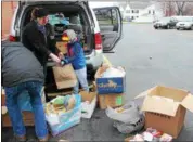  ?? TAWANA ROBERTS — THE NEWS-HERALD ?? Colin Metz, who is 7 years old, organized a collection drive and distribute­d donations to people who were less fortunate at St. Mary Catholic Church in Painesvill­e on Feb. 22.