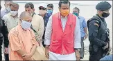  ?? HT ?? ■
Chief minister Yogi Adityanath with Jal Shakti minister Mahendra Singh during the visit on Saturday.