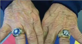  ?? BY PAUL POST ?? Bucky Dent displays the 1977 and ‘78 World Championsh­ip rings he won with the Yankees.