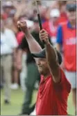  ?? JOHN AMIS — THE ASSOCIATED PRESS ?? Tiger Woods celebrates after his final par putt on 18 to win the Tour Championsh­ip Sunday in Atlanta.