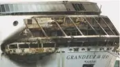  ?? JENNEVA RUSSELL, THE FREEPORT NEWS, VIA AP ?? The fire-damaged exterior of Royal Caribbean’s Grandeur of the Seas ship sits docked in the Bahamas on Monday. Damage appears more widespread than first reported.