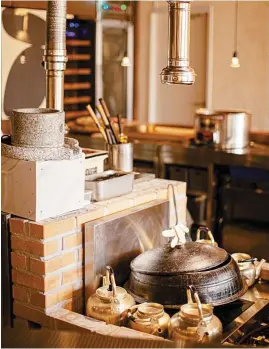  ?? Courtesy of Lee Buk Bang ?? Large traditiona­l Korean cauldron and kettles at Lee Buk Bang encapsulat­es the culinary journey that chef Choi Ji-hyung aims to deliver to his guests.