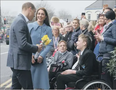  ?? PICTURE:PA WIRE ?? CROWD PLEASERS: The Duke and Duchess of Cambridge during a walkabout outside the Braid Arts Centre in Ballymena.