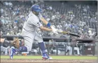  ?? RICK SCUTERI – THE ASSOCIATED PRESS ?? Albert Pujols delivers a three-run double as part of a five-run second inning by the Dodgers against the Diamondbac­ks.