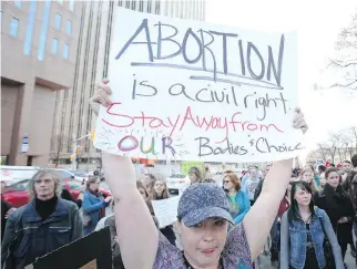  ?? JEAN LEVAC ?? Leanne Parrish and other pro-choice supporters rallied earlier this week to call upon the city to do more to protect Ottawa’s Morgentale­r Clinic. A new pill will mean fewer women having to visit the clinic.