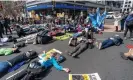  ?? ?? Activists stage a ‘die-in’ in front of a Chase branch. Photograph: Alex Brandon/AP